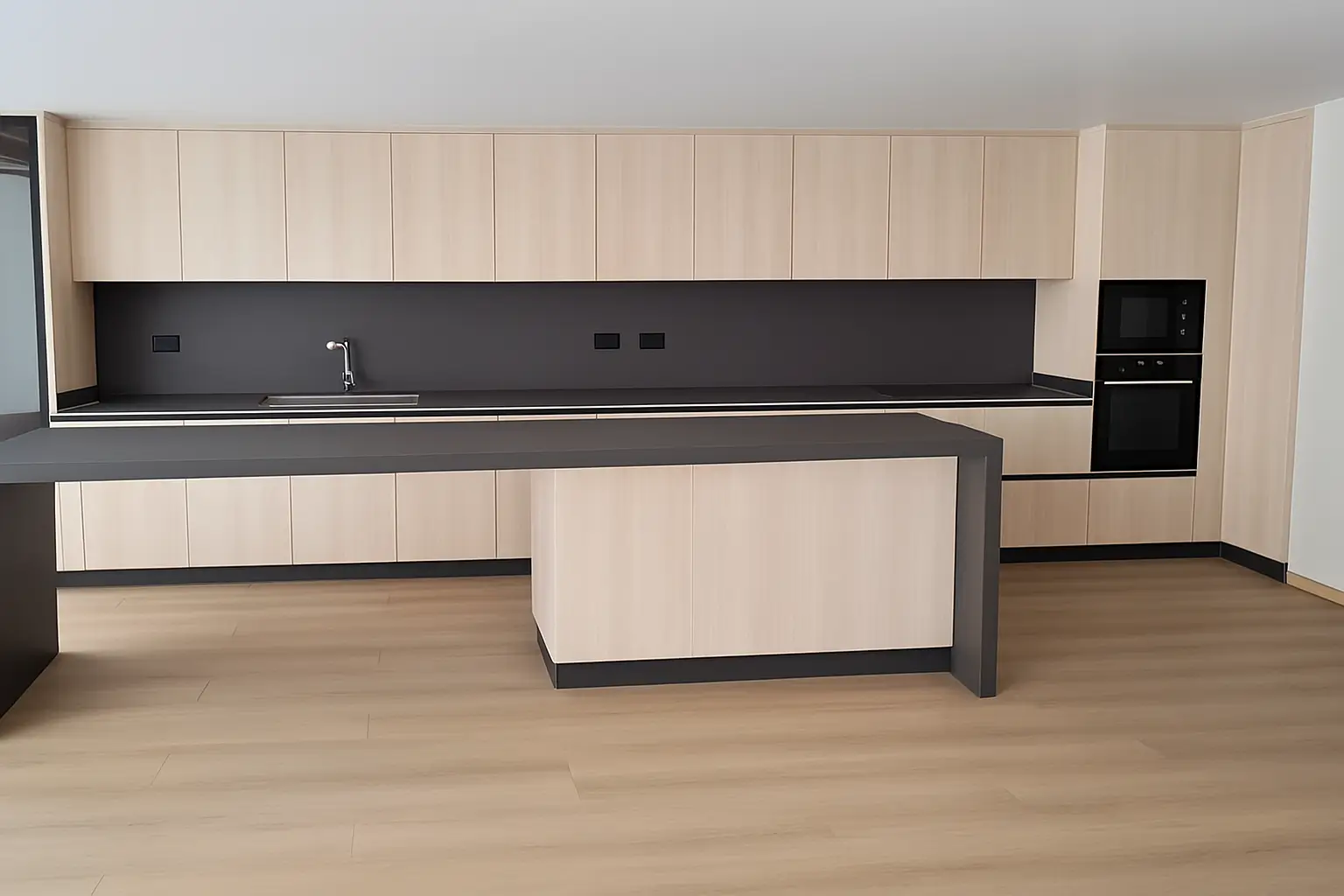 Cocina moderna con muebles de melamina en acabado madera clara, encimera y salpicadero en granito gris oscuro, isla tipo T y diseño minimalista con iluminación natural